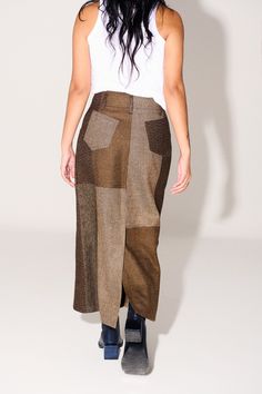 A classic straight-fit midi skirt in patchwork perfection, a Fall must-have. FEATURES: Patch-worked exterior. Clean finished single-stitch waistband, classic patch pockets at back and curved denim inspired pockets at front. Elongated vent at center back for ease of wear. MAKING: Made in Lima, Peru by master tailor Nore Encizo and his team. CONTENT: 100% Upcycled Merino Wool. FIT: Sits at Waist. Midi/ Ankle length. MODEL IS WEARING A SIZE 8. MADE TO ORDER SIZES SHIP 4 WEEKS FROM ORDER DATE. Fitted Midi Skirt, Master Tailor, Fall Must Haves, Lima Peru, Upcycled Fashion, 2024 Trends, Conscious Fashion, Cute Everyday Outfits, Wool Skirts