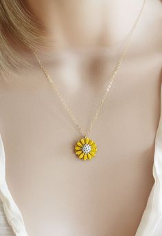 "This pendant is from my vintage garden collection, sweet adorable tiny yellow enamel daisy measures 50\" in diameter. Hangs from a new 14 karat gold filled cable chain . Spring closure clasp. The Daisy is vintage an in mint condition The model is wearing a 16\" length. H A N D M A D E * We hand make all pieces in our Water Mill New York studio * We source eco friendly packaging and materials, including recyclable mailers! FREE BOX AND WRAP ON EVERY ORDER P R O D U C T I O N ∙ T I M E S All item Yellow Gold Flower Charm Necklace With Delicate Chain, Yellow Flower Necklaces For Jewelry Making, Gold Sunflower Design Necklace, Yellow Flower Shaped Jewelry With Adjustable Chain, Dainty Handmade Yellow Jewelry, Dainty Yellow Pendant Jewelry, Delicate Yellow Necklace For Gift, Vintage Gold Jewelry With Sunflower Design, Dainty Yellow Flower Shaped Jewelry