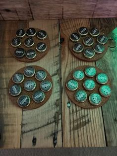 three wooden coasters sitting on top of a table covered in green waxed buttons