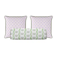 two pillows with green and purple designs on them