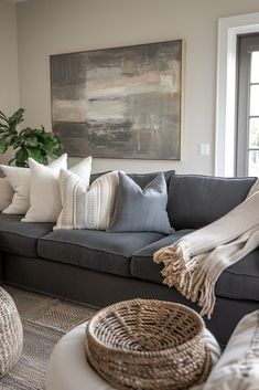 a living room filled with lots of furniture and pillows