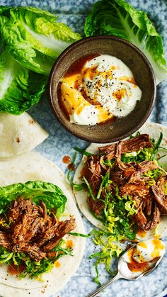 shredded beef and lettuce wraps on tortillas with yogurt sauce