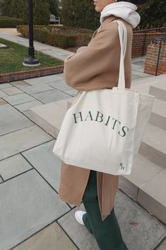 The Habits Oversized Canvas Tote is your new go to bag for all things related to your daily life. Made from our signature brushed cotton canvas in 8oz, this bag is both sturdy and soft. Two different sizes of handles allow for bags to be held in hand or carried comfortably on your shoulder. Dimension: 14 1/2"W x 14 1/2"H x 8"D RH-701-CANVAS Made in USA Everyday Large Capacity Cotton Bag, Large Capacity Cotton Bag For Everyday Use, Everyday Canvas Bag With Letter Print, Cotton Tote Bag For Daily Life, Eco-friendly Cotton Shoulder Bag For Daily Use, Cotton Rectangular Shoulder Bag For Daily Use, Everyday Cotton Bag With Letter Print, Everyday Cotton Bags With Letter Print, Canvas Bag Outfit