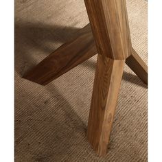 a close up of a wooden table on the floor