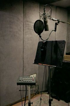 a recording studio with microphones and sound equipment