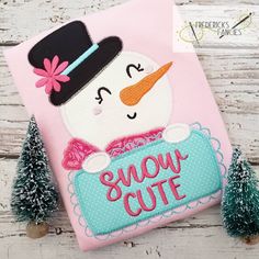 a snowman applique on a pink shirt with the words snow cutie