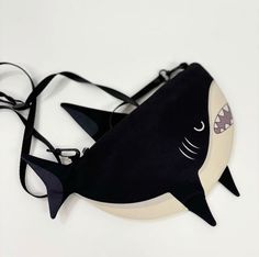 Adorable Shark Crossbody Bag - Perfect for Little Ocean Explorers Dive into the fun with this adorable shark crossbody bag! Made from high-quality canvas, this versatile bag functions as a small shoulder bag or messenger bag, making it perfect for people who love marine life. Its playful shark design adds a touch of excitement to everyday adventures. 🌊 Unique Shark Design: This cute shark bag features a detailed and playful design, ideal for any shark enthusiast. 🌊 Durable Canvas Material: Cra Shark Bag Sewing Pattern, Adorable Shark, Shark Bag, Shark Design, Pouch Purse, Cute Shark, Cute Wallets, Everyday Adventures, Bag Patterns To Sew