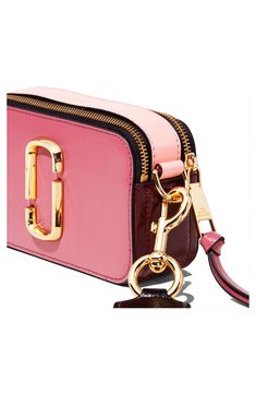 This compact handbag packs a major style punch with gleaming logo hardware and a statement-making strap. Whether worn crossbody or carried as a clutch, the sized-down style is an outfit-making must-have. Style Name:The Marc Jacobs The Snapshot Leather Crossbody Bag. Style Number: 5351361. Trendy Pink Bags With Logo Hardware, Trendy Pink Shoulder Bag With Logo Hardware, Pink Shoulder Bag With Logo Hardware For Travel, Pink Travel Shoulder Bag With Logo Hardware, Snapshot Bag, Purple Bags, Rebecca Minkoff Mac, Leather Crossbody Bag, Leather Crossbody