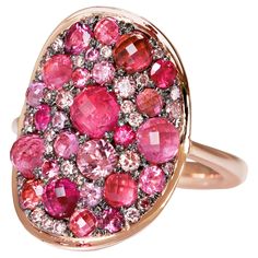 One of a kind Mahenge and Pink Spinel, Pink Tourmaline, Pink Diamond and Ruby Rose Gold Ring, meticulously crafted by Belgian jewellery artist Joke Quick. This extraordinary piece captures the essence of elegance and sophistication with its stunning blend of Pink and red shades. Unlike mass-produced rings, Joke Quick's creations are entirely handcrafted, avoiding any casting or printing techniques. The distinctive feature of these remarkable rings lies in their comfortable fit because of its flat, curved design that contours seamlessly around the finger and their captivating "mosaic setting," where diamonds and gemstones are meticulously placed in such proximity that they form a seamless and breathtaking mosaic pattern. 18K Rose gold 10 g 5 X intense Pink spinels faceted cabochons : 1,27 c Artist Joke, Grey Diamond Engagement Ring, Red Shades, Cognac Diamonds, Pink Spinel, Yellow Diamond Rings, Purple Sapphire, Right Hand Rings, Diamond Mosaic