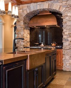 a kitchen with an oven, sink and counter tops in it's center island