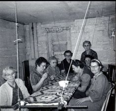 a group of people sitting around a table