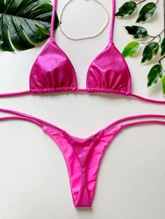 Metallic pink fabric The top Triangle bikini top with ties at the neck and back. The bottom is a bikini thong with adjustable side ties.   If you would like without the side ties check our Afrodite. https://www.etsy.com/listing/1218095823/bikini-afrodite-classic-thong-bikini-low Our bikini bottoms are fully lined making them durable and of high quality comfortable to wear all day at the beach. Authentic Brazilian style made in Europe BEFORE ORDERING FROM US Please notice we do not EXCHANGE or RE Pink T-back Swimwear For Party, Pink String Swimwear For Beach Season, Pink String Swimwear For Sunbathing, Pink String Swimwear, Pink String Swimwear For Swimming, Adjustable Pink Swimwear For Pool, Pink Triangle Top Swimwear For Festival, Pink Adjustable Swimwear, Pink Triangle Top Swimwear For Party