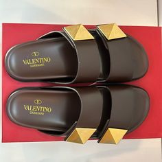 Valentino One Stud Leather Sandals Size: 39 Conditions: Like New. Worn Once. Designer Calf Leather Sandals With Studded Outsoles, Designer Calf Leather Slides With Round Toe, Designer Leather Slides For Vacation, Designer Leather Sandals For Vacation, Designer Brown Sandals For Vacation, Designer Calf Leather Flat Slides, Designer Brown Calf Leather Sandals, Designer Leather Slides For The Beach, Designer Brown Flat Slides