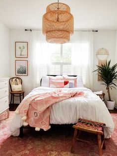 a bedroom with white walls and pink carpet