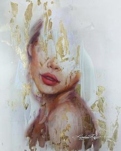 a painting of a woman's face with gold paint