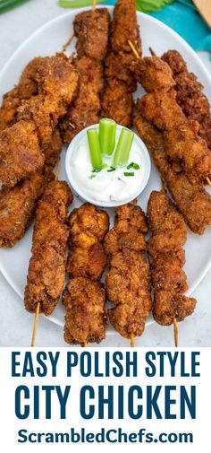 chicken skewers on a white plate with ranch dressing and celery sticks