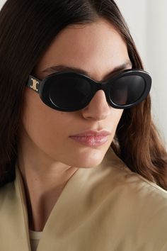 CELINE Eyewear's sunglasses have been made in Italy from black acetate and have modern oval-shaped frames. They're adorned with an archival logo plaque - first introduced by the label's founder in 1973 - and fitted with dark lenses. Celine Glasses, Celebrity Sunglasses, Celine Sunglasses, Trending Sunglasses, Acetate Sunglasses, Cool Sunglasses, Oval Sunglasses, Eyewear Womens, Oval Frame