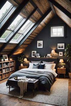 an attic bedroom with dark walls and wood floors