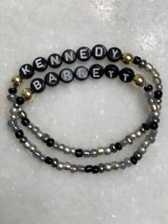 Black and silver beaded personalized bracelets with black and white letters! These bracelets are the perfect combination of playful and chic. You can buy one or a whole stack! Indicate personalization below. These are beads so handle with care. Standard length 6.75 inches, for children 6 inches. Customized Black Beaded Bracelets, Customized Black Beaded Bracelets For Everyday, Customized Black Jewelry For Everyday, Casual Black Jewelry For Personalized Gifts, Silver Beaded Bracelet With Custom Name For Friendship, Casual Black Name Bracelet For Everyday, Customizable Black Stretch Bracelet For Personalized Gift, Silver Custom Name Beaded Bracelet For Friendship, Trendy Customizable Silver Name Bracelet