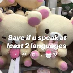 two teddy bears sitting next to each other with the words save if u speak at least 2 languages