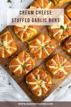 cream cheese stuffed garlic buns on a cutting board with text overlay that reads, cream cheese stuffed garlic buns