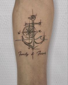 a man's foot with a compass and anchor tattoo on the side of his leg