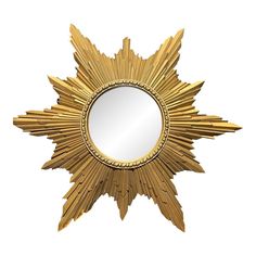 a gold star shaped mirror on a white background