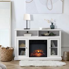 a living room with a fire place in the center and a rug on the floor