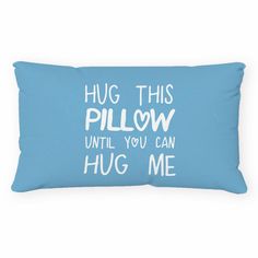 a blue pillow with the words hug this pillow until you can hug me on it