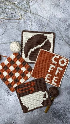 three crocheted coasters sitting on top of a table