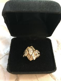 an antique diamond ring in a velvet case