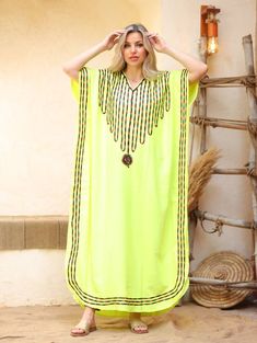 An elegant and stylish caftan will make you feel like African royalty. It's extremely elegant with a dash of colorful cotton embroidery adorning the kaftan. Ideal for plus size women as well. Made of extremely soft fabric to make you feel free and beautiful at the same time.  This Kaftan is ideal to wear for any casual occasion. Whether taking a trip down the shopping lane, or home-based kitty parties, or about anything else, wearing this dress will make you feel classy and comfortable. Fabric : Yellow Embroidered Maxi Dress For The Beach, Green Kaftan For Vacation And Eid, Green Kaftan For Eid Vacation, Long Embroidered Free Size Kaftan, Traditional Green Free Size Kaftan, Yellow Embroidered Maxi Dress For Beach, Traditional Free Size Thobe For Vacation, Embroidered Free Size Kaftan, Traditional Oversized Kaftan For Festivals