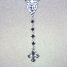 "Inspired by Yolanda Foster Rosary on The Real Housewives of Beverly Hills - shown in Black crystal and silver. This listing is for a custom made rosary necklace 20\" long (excluding the drop) made with Swarovski 4mm pearls or crystals in your choice of color. You will have your choice or gold or silver findings including the cross and center connector. Each rosary is 4 decades plus the drop and has a lobster clasp and a 3\" extension. Can also be made as an Anglican or Jewish rosary. Convo me f Silver Necklace With Miraculous Medal For Jewelry Making, Silver Necklace With Miraculous Medal For Wedding, Silver Jewelry With Miraculous Medal For Gift, Silver Miraculous Medal Jewelry For Wedding, Crystal Crucifix Jewelry As Gift, Silver Miraculous Medal For Wedding, Silver Crucifix For Wedding, Handmade Silver Wedding Rosary, Personalized Silver Crucifix Jewelry