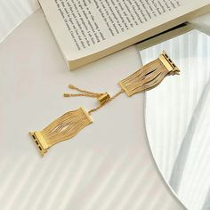 This band features a unique tassel chain design that adds a sophisticated and feminine touch to your wrist. Crafted from high-quality stainless steel, it offers durability and elegance, making it a perfect choice for any occasion. Features: Compatibility: This women's Apple Watch band is compatible with Apple Watch Series 7 / 8 / 9 (45mm), Apple Watch Ultra (49mm), SE / SE (2nd Gen), Series 6 / 5 / 4 (44mm), and Series 3 / 2 / 1 (42mm). Please check the back of your watch to ensure you order the correct size. Tassel Chain Design: The soft stainless steel tassel design on this Apple Watch chain band provides an extra level of sophistication and style, making you stand out from the crowd. Its slim and elegant design adds a chic and feminine look to your iWatch, while the carefully crafted co Apple Watch Style, Apple Watch Bands Gold, Bracelet Apple Watch, Watch Ultra, Chain Design, Watch Chain, Fabric Sale, Stainless Steel Band, Apple Watch Band