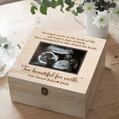 a wooden box with an image of a baby in the crib