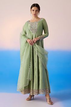 Sage green padded anarkali with thread embroidered floral blossom patterns, embellished by sequins and crystals. Comes with dupatta. - Aza Fashions Green Anarkali Kurta In Chinon, Pista Green Anarkali Dress In Chinon, Pista Green Maxi Length Anarkali Set For Eid, Eid Pista Green Maxi Anarkali Set, Traditional Pista Green Gown With Mirror Work, Green Dola Silk Gown For Eid, Pista Green Maxi Length Anarkali Set With Dupatta, Pista Green Anarkali Dress In Chinon Fabric, Pista Green Gown With Dabka Work And Traditional Drape