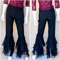 💃90s Vintage High-Waisted SELENA Pants with Tiered Ruffle Hem💃 These black 90s vintage pants feature a sleek, high-waisted cut with a dramatic tiered chiffon ruffle hem for a striking, flared silhouette. The structured black fabric offers a fitted shape through the hips, while the flowing ruffles add movement and volume. Finished with a discreet zipper back closure, these pants are a bold throwback to retro glam. Great for a Selena Quintanilla costume! Shirt also available in my shop. Excellent pre-loved condition with no flaws to note. No snags in the chiffon. Era: 90s 1990s Brand: Flamingo Tag Size: 5/6 Measurements Flat & Approximate: (Slight stretch) Waist: 13" Hips: 18" Rise: 11" Thigh: 11" Inseam: 32" Leg Opening at smallest: 8"  Polyester & Rayon MADE IN THE USA Fitted Vintage Bottoms With Ruffles, Ruffle Flare Pants, Stretch Full-length Ruffled Bottoms, Fitted Ruffled Flare Pants, Gothic Stretch Ruffle Bottoms, Selena Quintanilla Costume, Black 90s, Retro Glam, Womens Pants