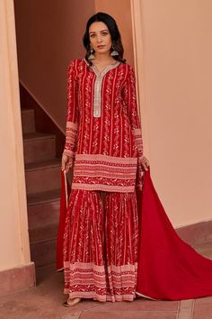 Red kurta with floral stripe print and zari thread, cutdana, sequin embroidered placket. Paired with sharara and dupatta. - Aza Fashions Semi-stitched Red Lehenga With Dabka Detailing, Unstitched Red Sharara With Dupatta, Red Sharara With Resham Embroidery And Traditional Drape, Red Sharara With Resham Embroidery, Red Georgette Lehenga With Dabka Detail, Red Georgette Lehenga With Dabka, Red Chinon Lehenga With Dabka Embroidery, Red Chinon Lehenga With Dabka Detailing, Wedding Red Palazzo Set With Dabka Work