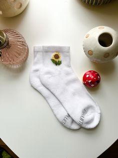 These hand-embroidered ankle socks feature a cute little cross-stitched sunflower 🌻 Perfect for you or someone you know that loves sunflowers or florals in general, or just likes wearing fun socks -- these are a super cute and unique addition to any outfit! ✨ Socks are each hand-stitched (with love) upon order 💘 Due to the items being made to order, processing times may take up to a week (but I do my very best to get them shipped out to you as fast as possible!) Caring for your hand-embroidered socks: The embroidery holds up very well in the washing machine, but for best results: Wash in cold water on the delicate cycle by themselves. Dry on the lowest temperature setting, also delicate if your dryer has the option.  Sock Information: Style: Fruit of the Loom All Day Comfort Ankle Socks Cute Sunflower, Embroidered Socks, Embroidered Cross, Socks Cute, Fun Socks, Casual Socks, Cool Socks, Ankle Socks, Hand Stitched