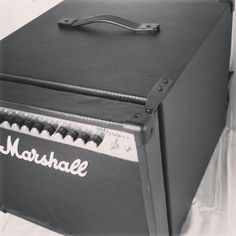 a black and white photo of an amp with the word marshall on it's side