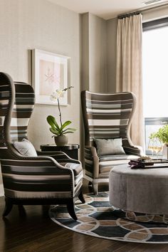 a living room filled with furniture and a large window