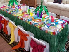 a long table covered in lots of colorful items