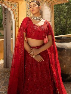 Are you seeking something exclusive? We've got what you require! This Red Net Heavy Thread Embroidery Lehenga with its gorgeous sequence embroidery and bright red color is the perfect option for those seeking to make an impact. You will certainly be the center of attention in this lehenga if you wear it to a wedding reception, an engagement party, or a sangeet. Pictured here is a bride wearing the Red Net Heavy Thread Embroidery Lehenga, which you can purchase today! Product Details: Lehenga Choli Color: Red Dupatta Color: Red Dupatta Fabric: Soft Net Choli Fabric: Net Lehenga Fabric: Net Work: Heavy Thread Embroidery Work Measurement: Customized in your size Shipping: Worldwide Traditional Dress For Women, Lehenga For Bride, Embroidery Lehenga, Red Lehenga, Embroidered Lehenga, Anarkali Kurta, Lehenga Saree, Sharara Set, Dress Rental