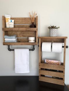 two wooden shelves with towels and toiletries on them