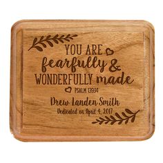 an engraved wooden box with the words you are fearless and wonderful made on it's side