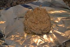 an uncooked cookie sitting on top of aluminum foil