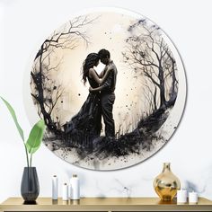 a couple kissing in front of a full moon with trees on the wall behind them