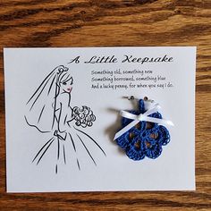 a card with a brooch that says a little keeps you close to the bride