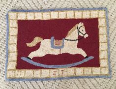 a rug with a rocking horse on it