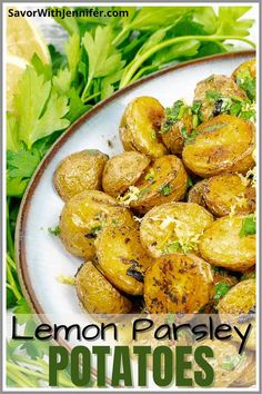 lemon parsley potatoes on a white plate with fresh herbs around the edges and text overlay that reads lemon parsley potatoes